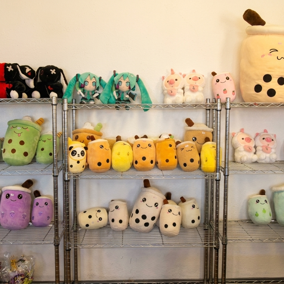 A metal shelving unit displays rows of various boba tea, animal, and character plush toys.